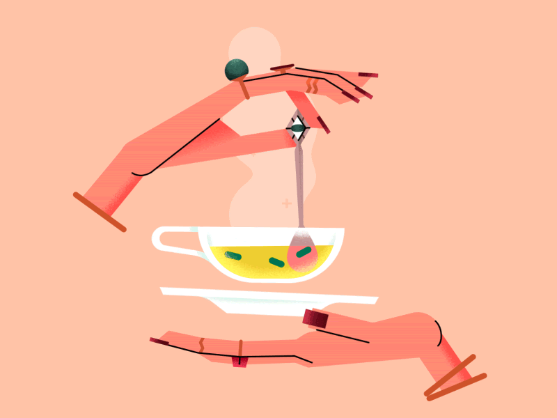 Hands stirring tea in a tea cup
