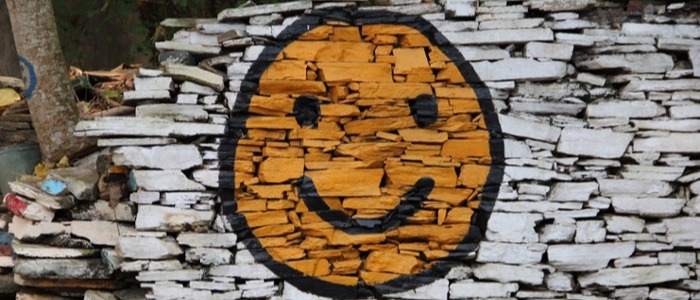 Smiley face painted on a wall