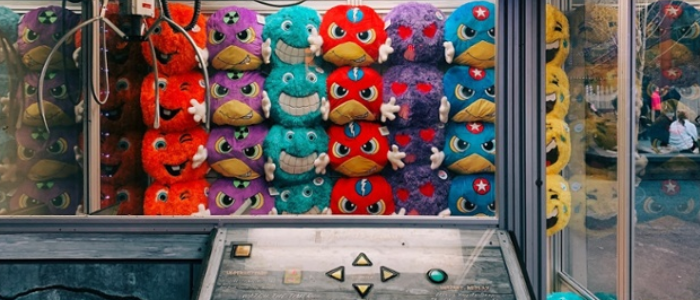 Claw machine filled with soft toys