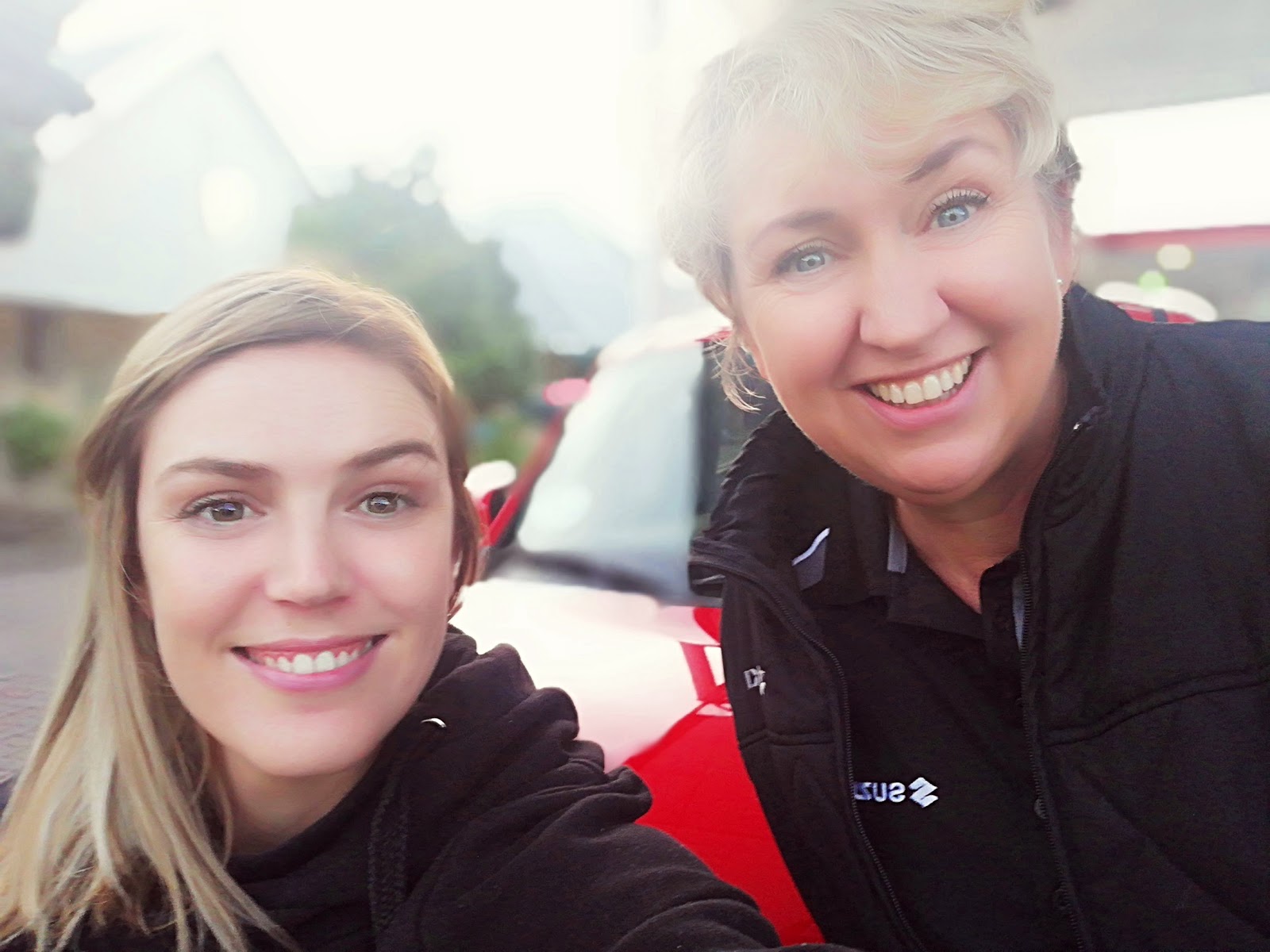 Two women smiling into camera